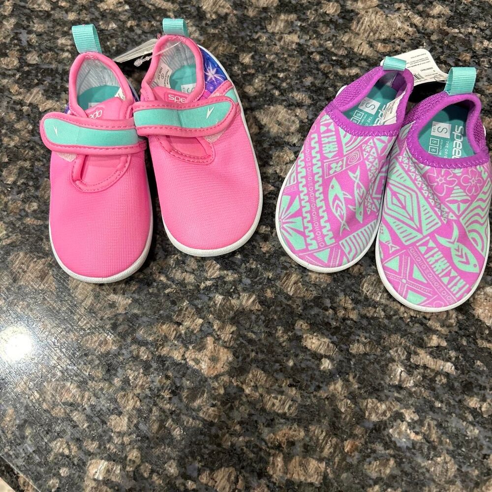 Bundle of 2 Pink and teal Speedo baby shoes with white geometric and fish design